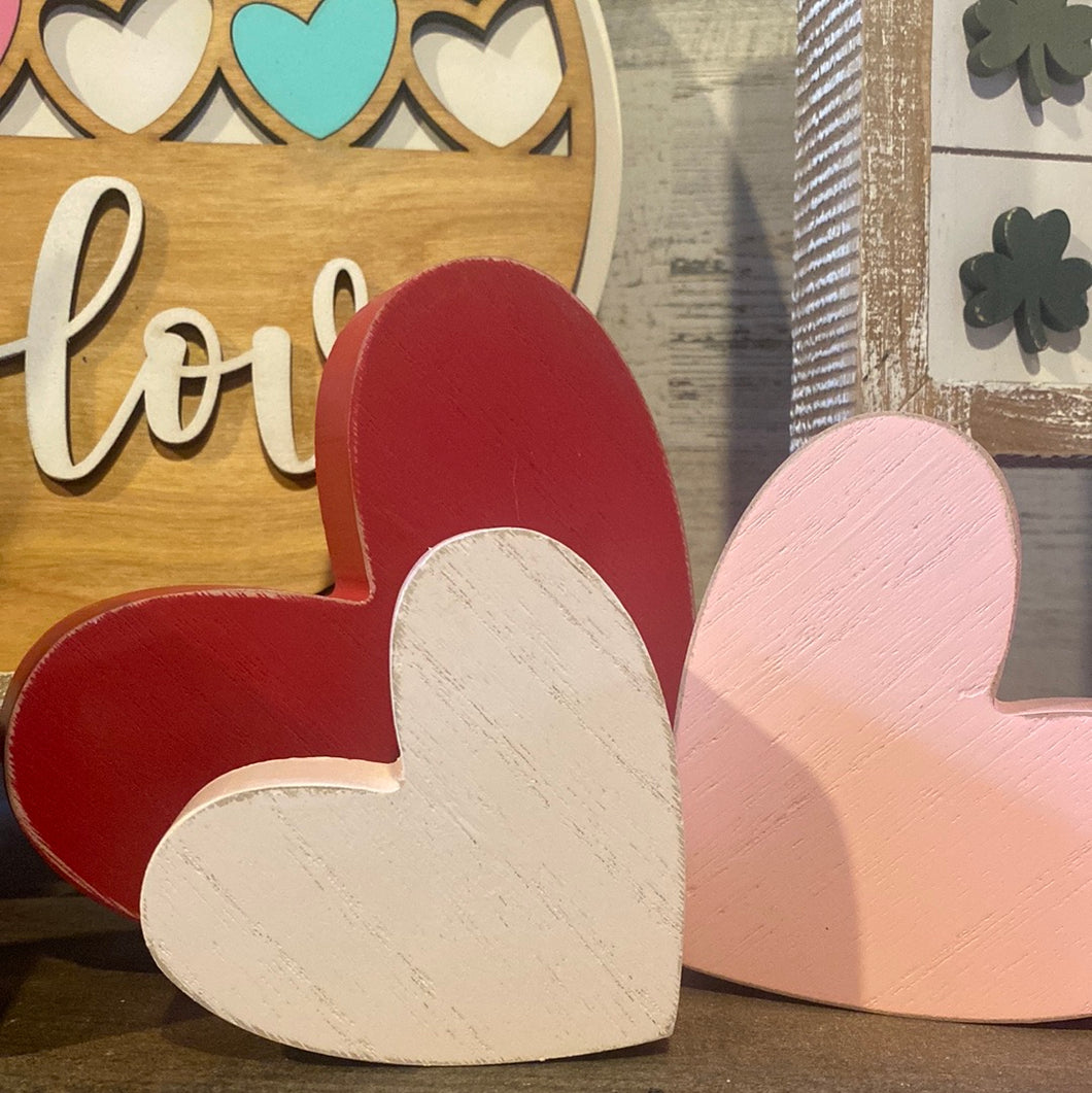 red, pink, white heart trio sitters